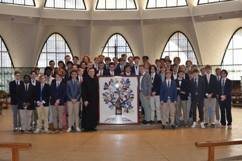 Priory Class of 2022 standing with their completed Senior Tie Project 